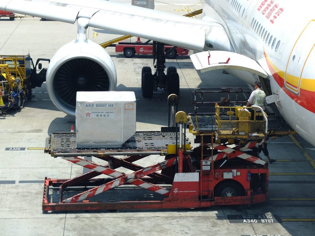 Airport Cargo Helper Jobs in Portugal 2026 | Salary, Requirements & Apply Now Airport cargo helper operating a ULD loader beside an aircraft