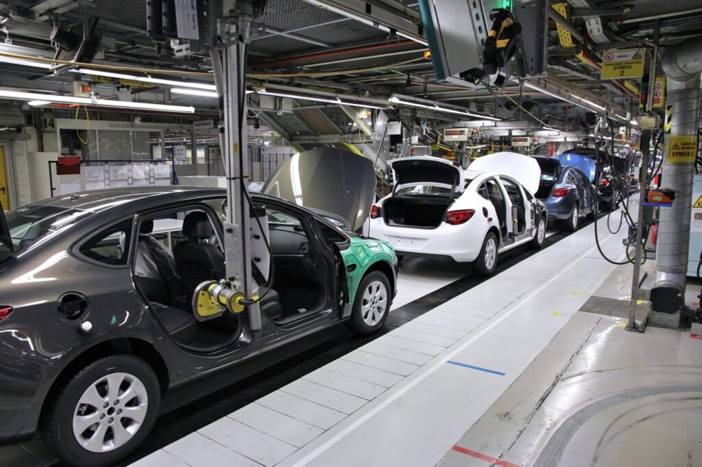 Factory worker on an automotive assembly line