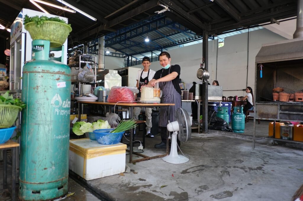 Kitchen Helper Jobs in Portugal 2026 | Salary, Requirements & Apply Now Kitchen helpers prepping ingredients on a commercial kitchen line