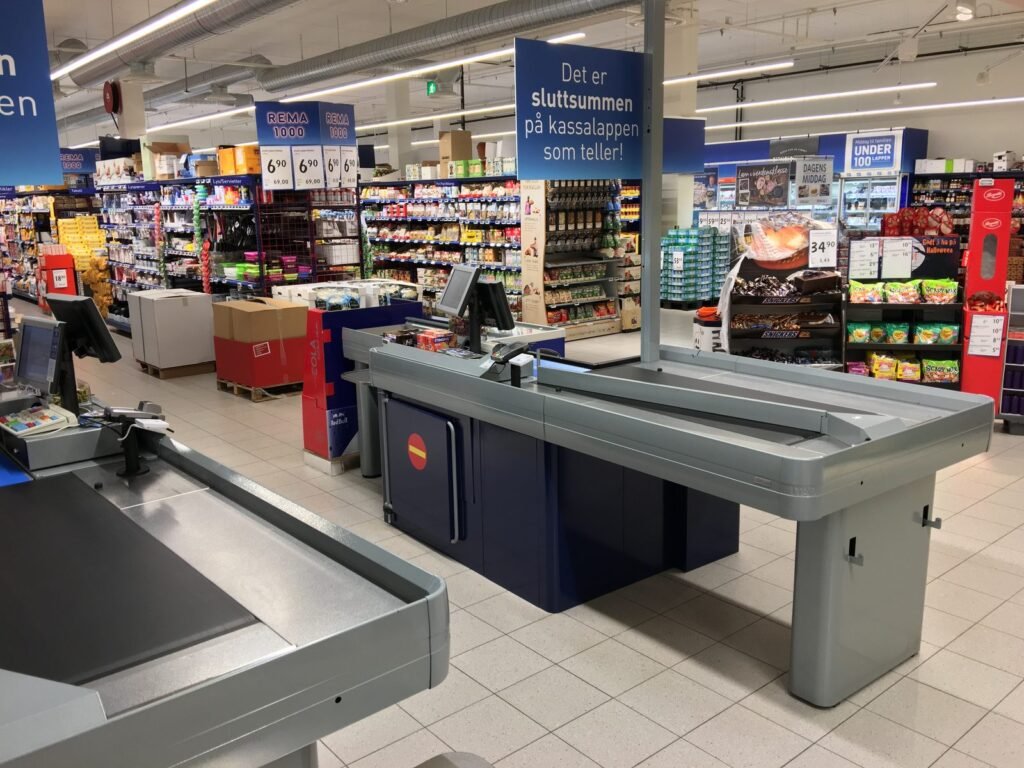 Supermarket Assistant Jobs in Portugal 2026 | Salary, Requirements & Apply Now Supermarket assistant at the checkout of a modern grocery store